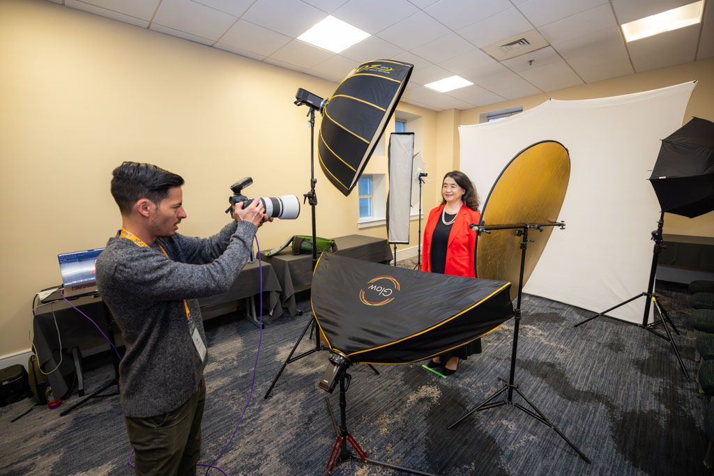 Corporate photographer captures headshot of woman in Philadelphia studio.